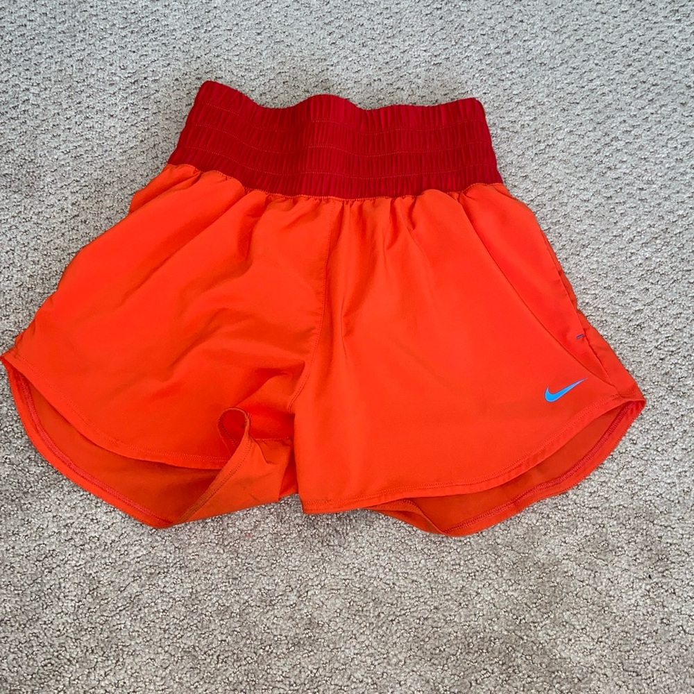 red and orange nike high waisted shorts